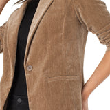 Brown corduroy blazer worn by a person on a white background