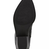 Close-up of a black shoe sole on a white background