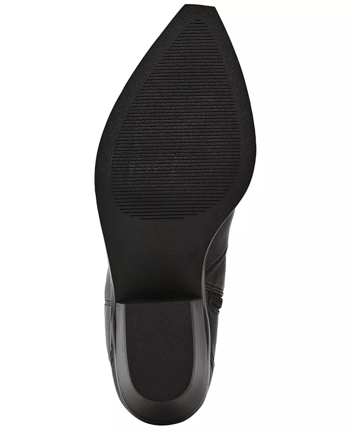 Close-up of a black shoe sole on a white background