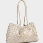Beige woven handbag with a rope handle on a light gray background