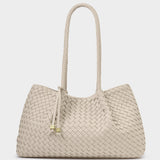 Beige woven handbag with rope handle on a white background