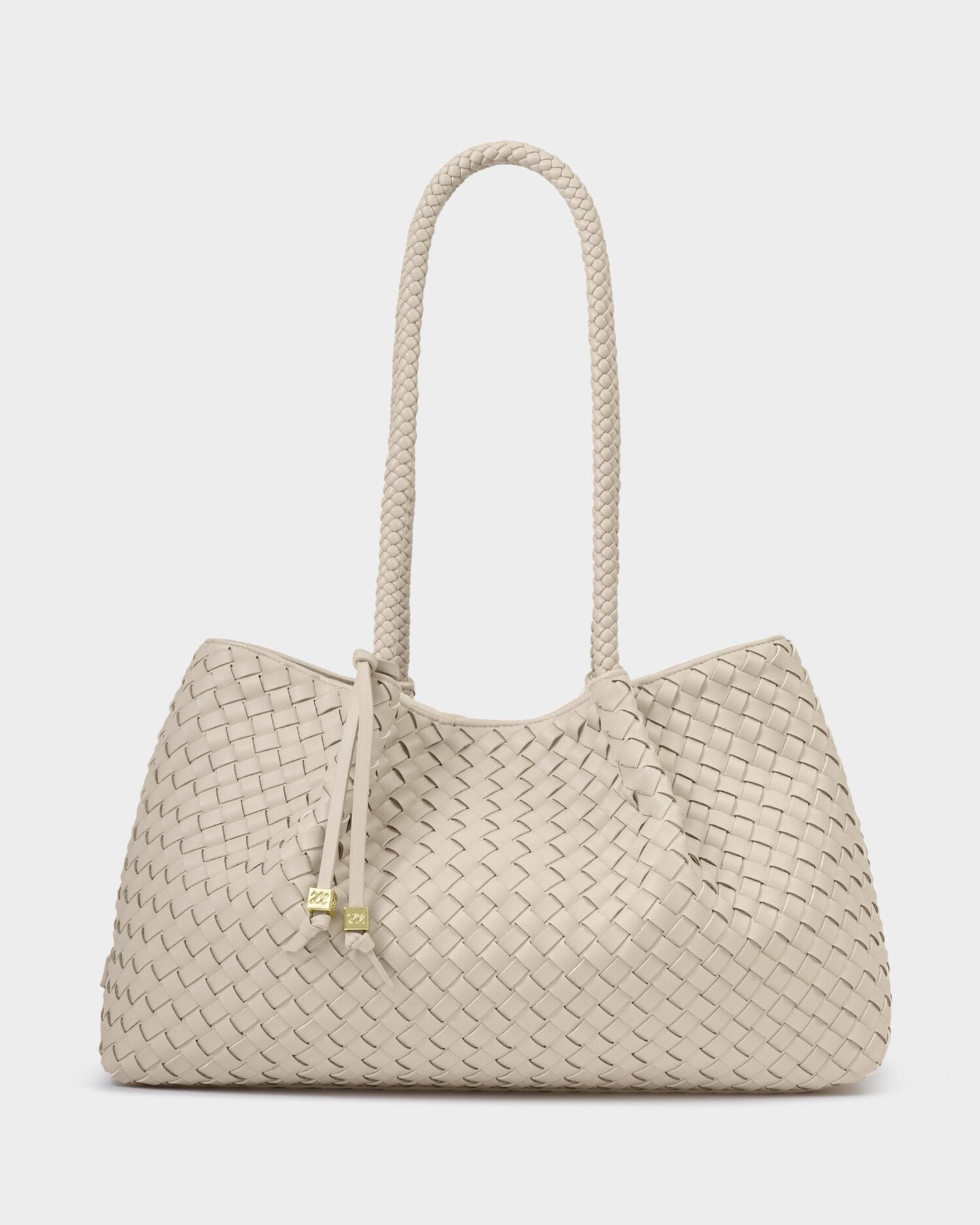 Beige woven handbag with rope handle on a white background