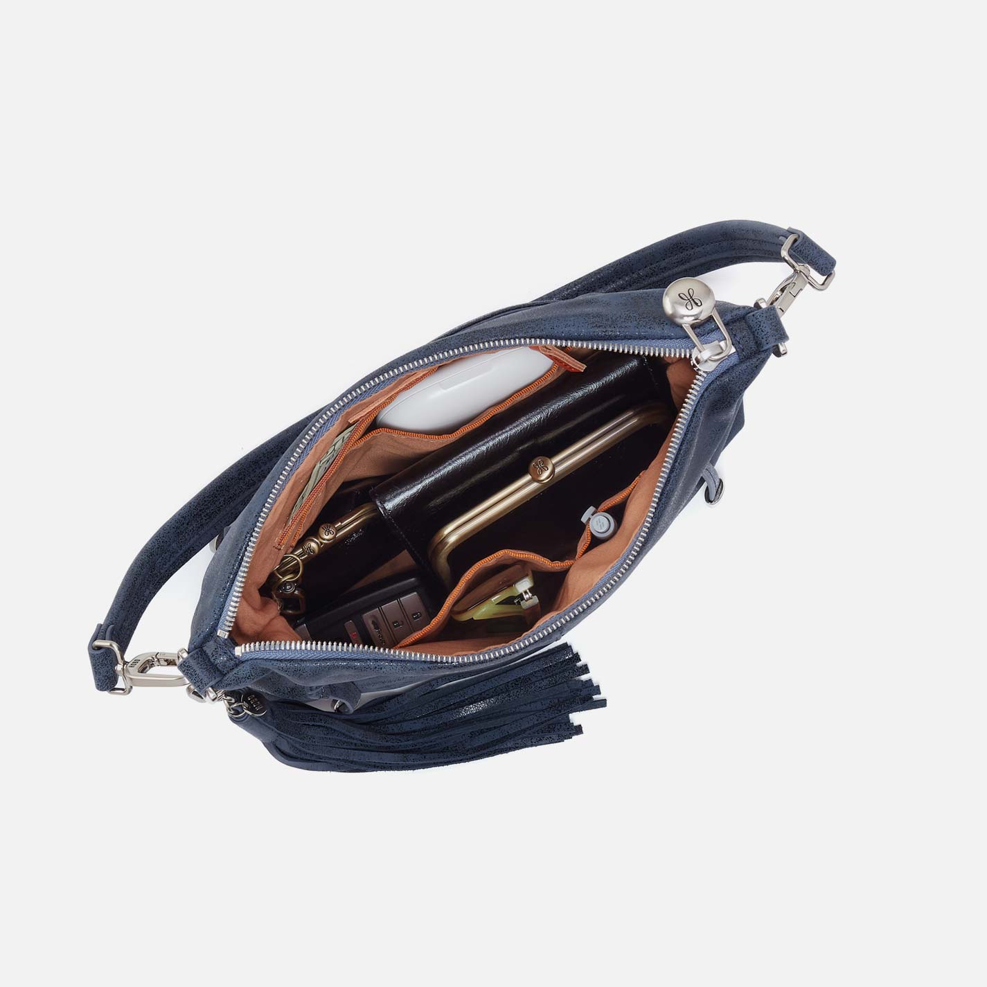 Open navy blue handbag with leather interior on a light gray background