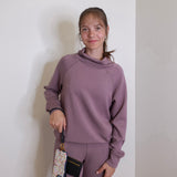 woman modeling the Hobo black phone wristlet 