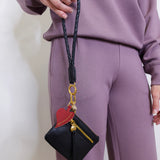 woman modeling the Hobo black phone wristlet 