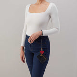 Woman wearing a lasso phone wristlet on her wrist 