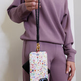 woman modeling the Hobo black phone wristlet 