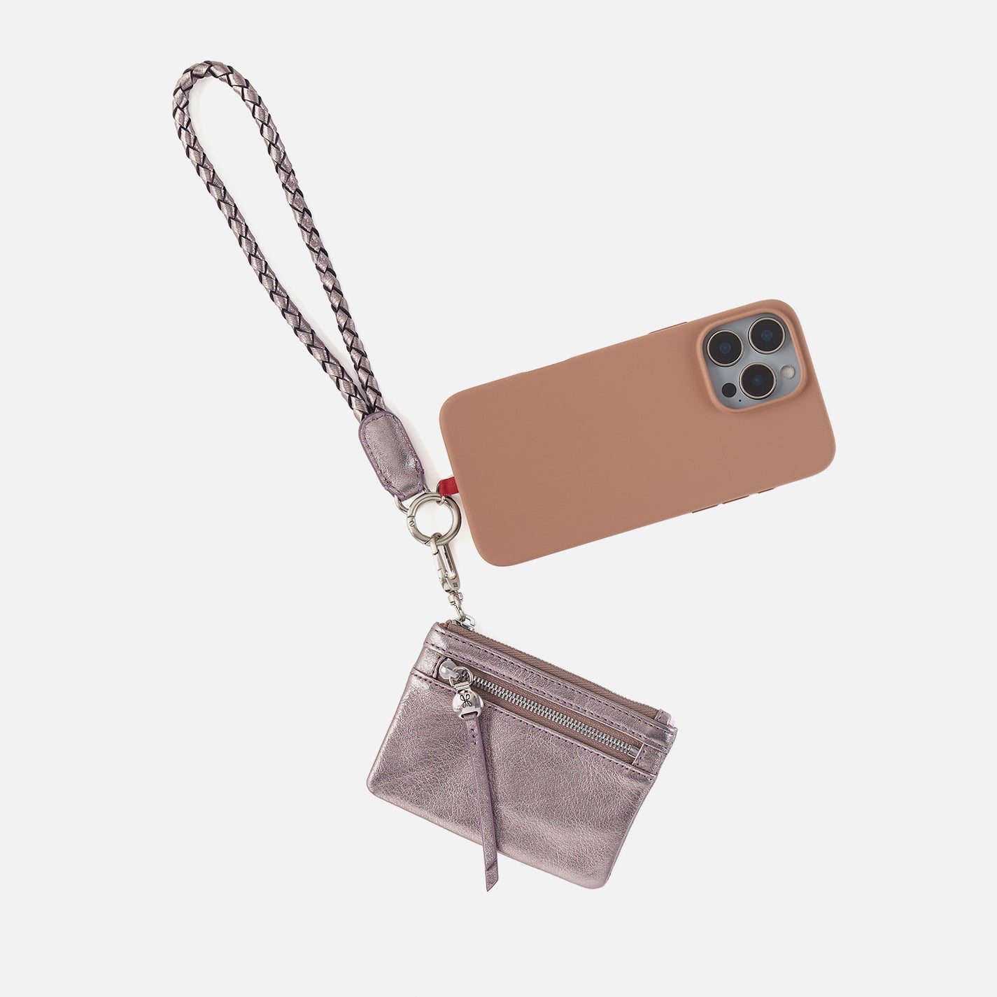 Hobo lasso phone wristlet in metallic leather, color pewter spur against a white background. 