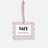 Pink photo frame ornament with 'tart by Taylor' branding on a white background