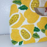 Handbag with lemon pattern on a white background