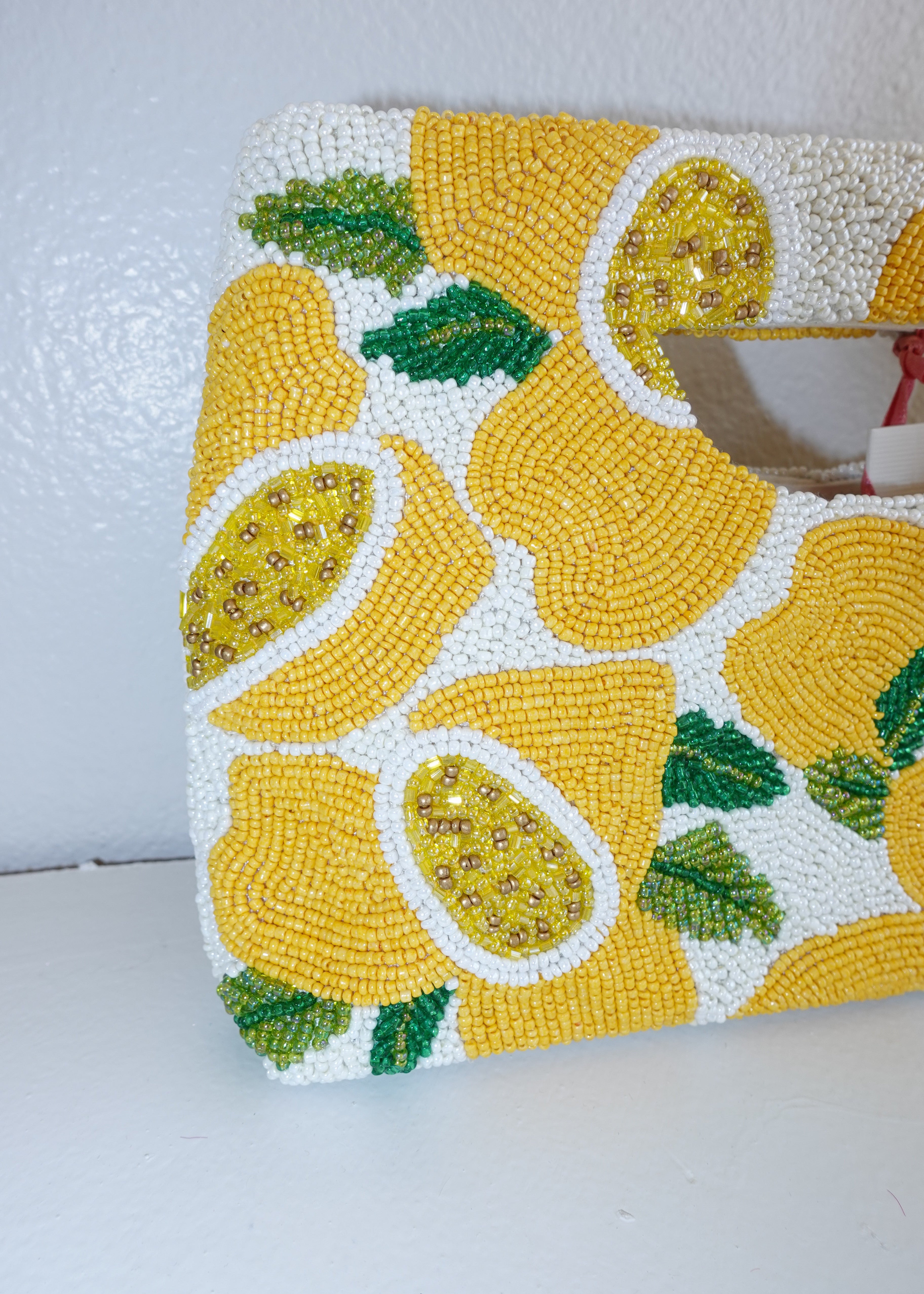 Handbag with lemon pattern on a white background