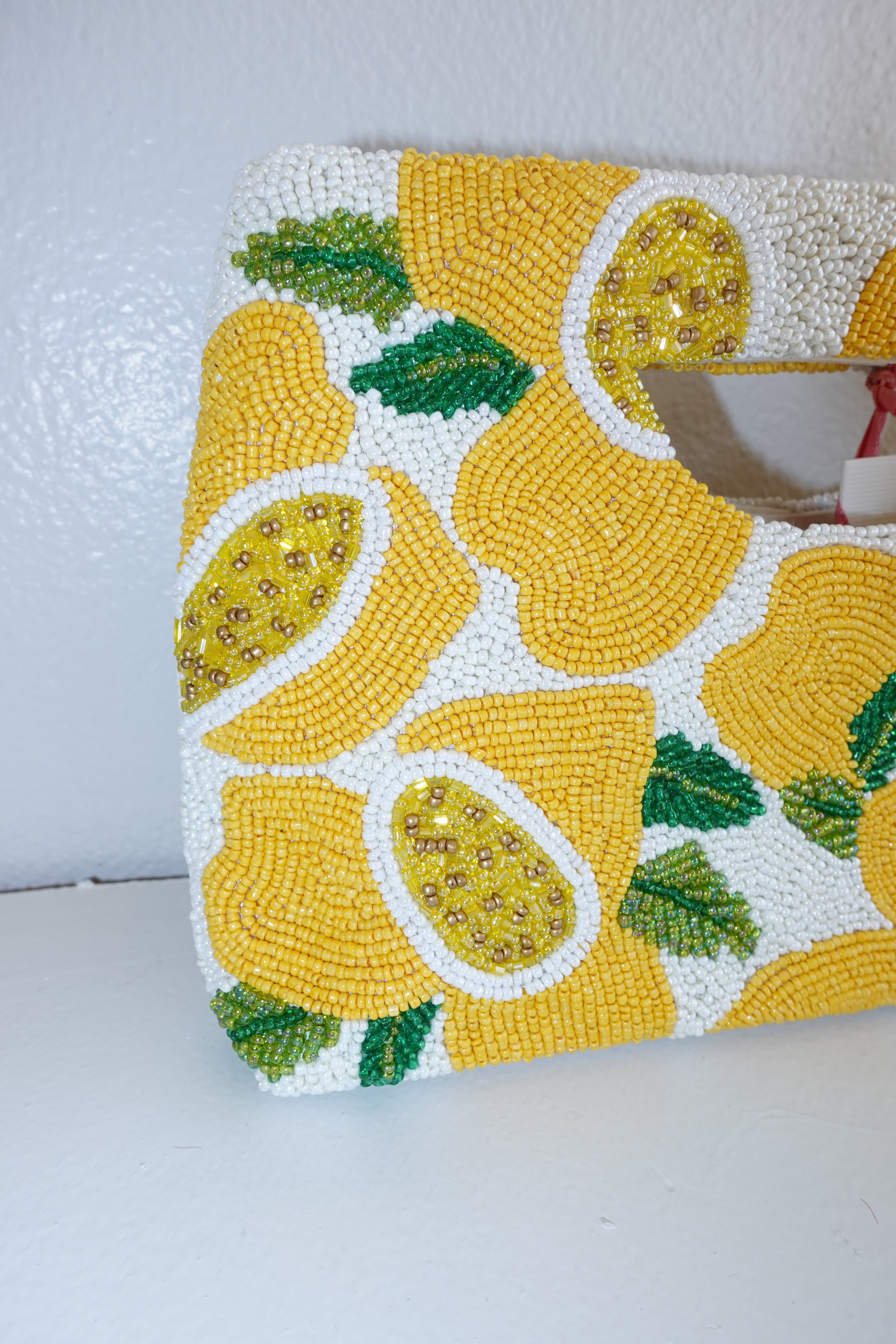 Handbag with lemon pattern on a white background