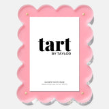Pink scalloped photo frame with 'tart by Taylor' branding on a white background