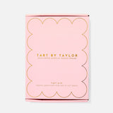 Pink packaging of Tart by Taylor scalloped acrylic photo frame on a white background