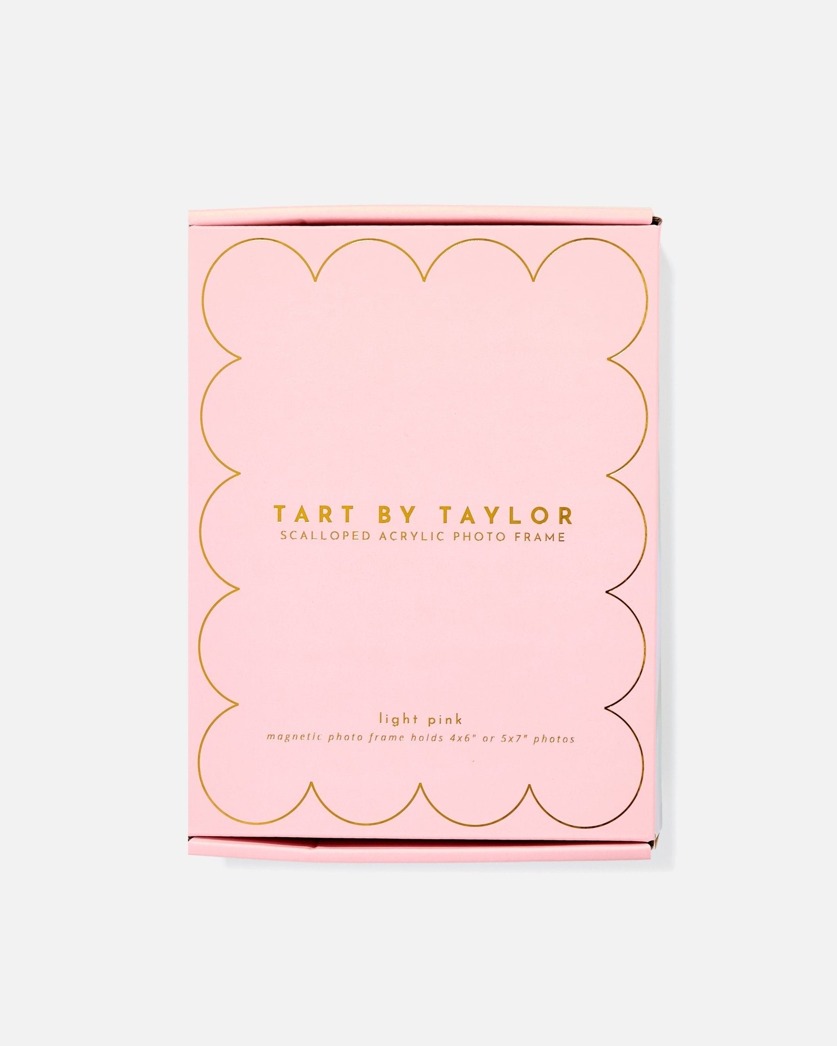 Pink packaging of Tart by Taylor scalloped acrylic photo frame on a white background