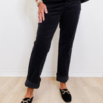 woman modeling black liverpool corduroy Markey girlfriend jeans against a white background. 