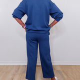Casual Liverpool pacific blue pull-on wide leg cropped pants worn by woman against white backdrop
