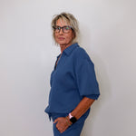 Liverpool V-neck popover collar sweatshirt in pacific blue on female model with white background