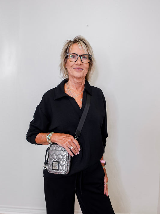 women modeling a black v neck sweatshirt in black