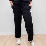 Women wearing Liverpool wide leg crop pant in black.