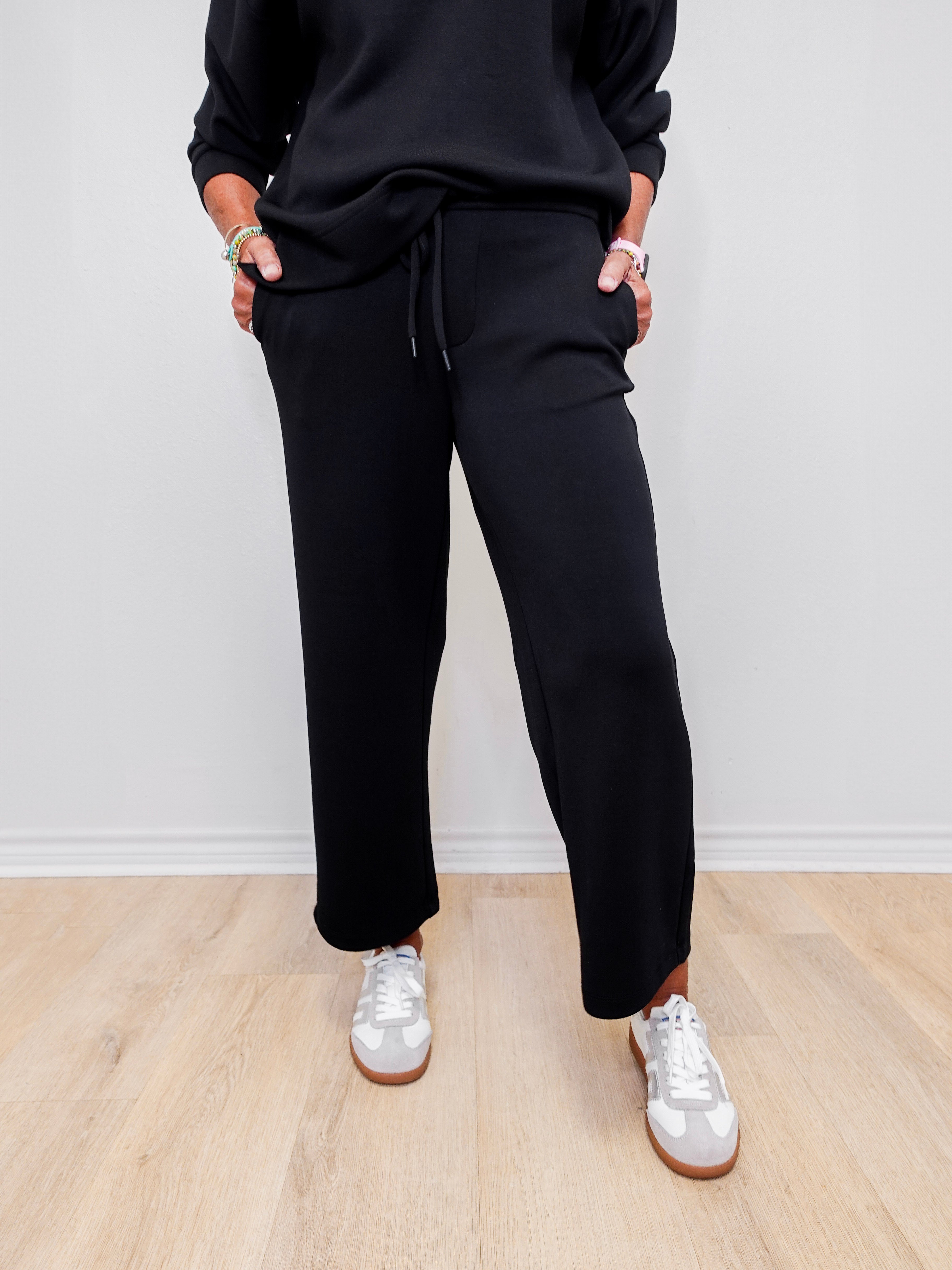 Women wearing Liverpool wide leg crop pant in black.