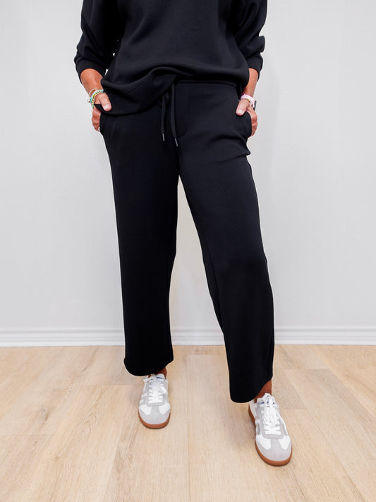 Women wearing Liverpool wide leg crop pant in black.