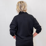 women wearing a black sweatshirt. 