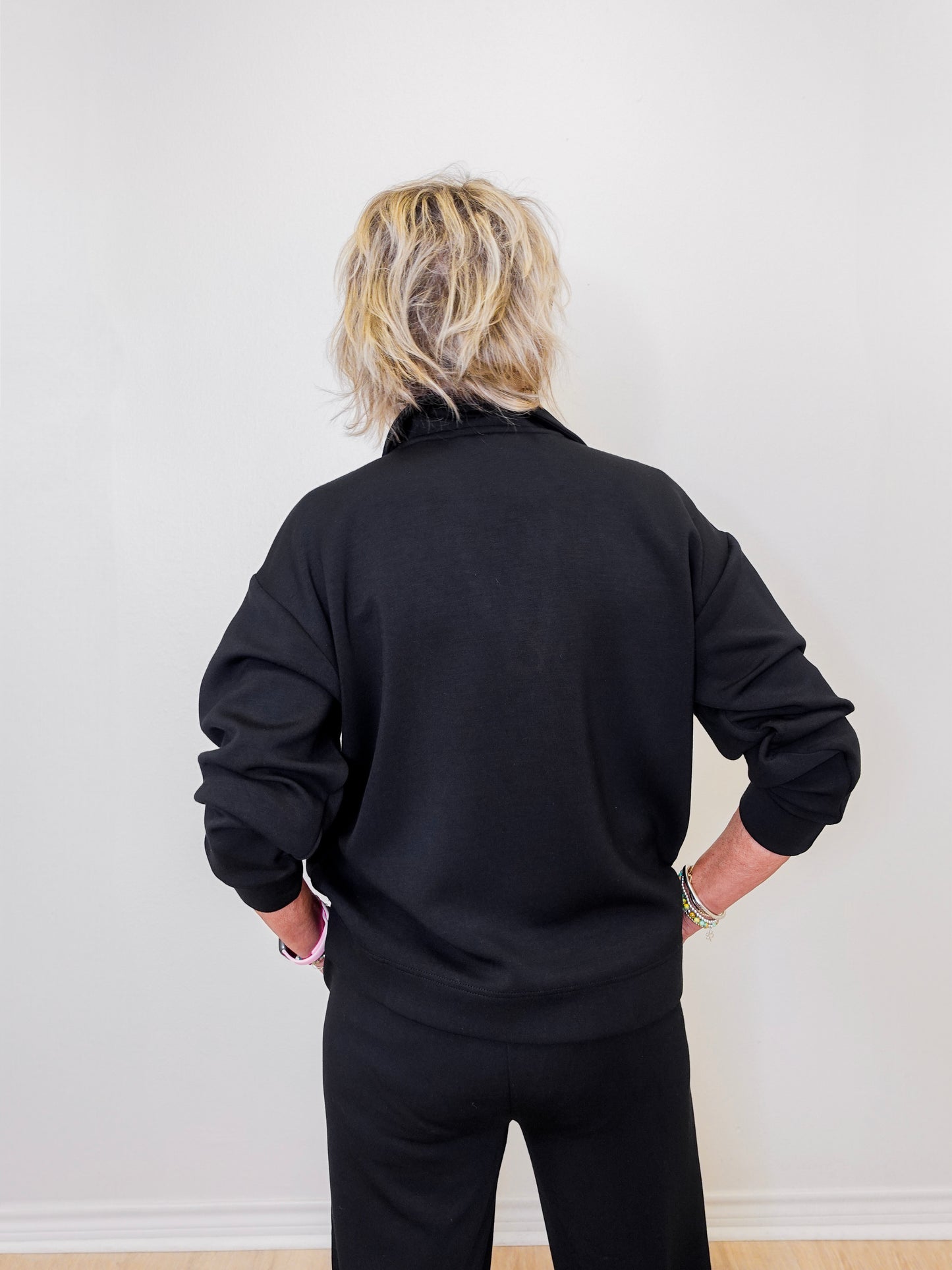 women wearing a black sweatshirt. 