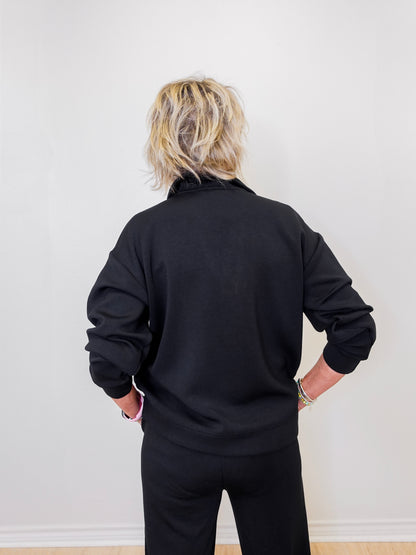 women wearing a black sweatshirt. 