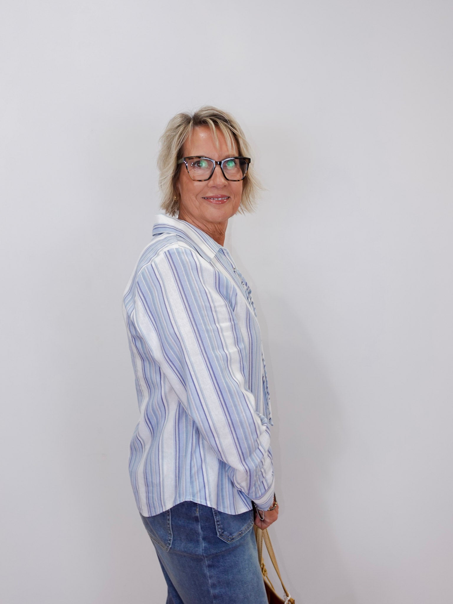 front view of the long sleeve lace up striped top by karen kane