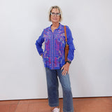 model wearing the luisa shirt in blue with embroidered detail styled with wide leg denim