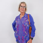 front view of the luisa shirt styled casually with jeans and sneakers