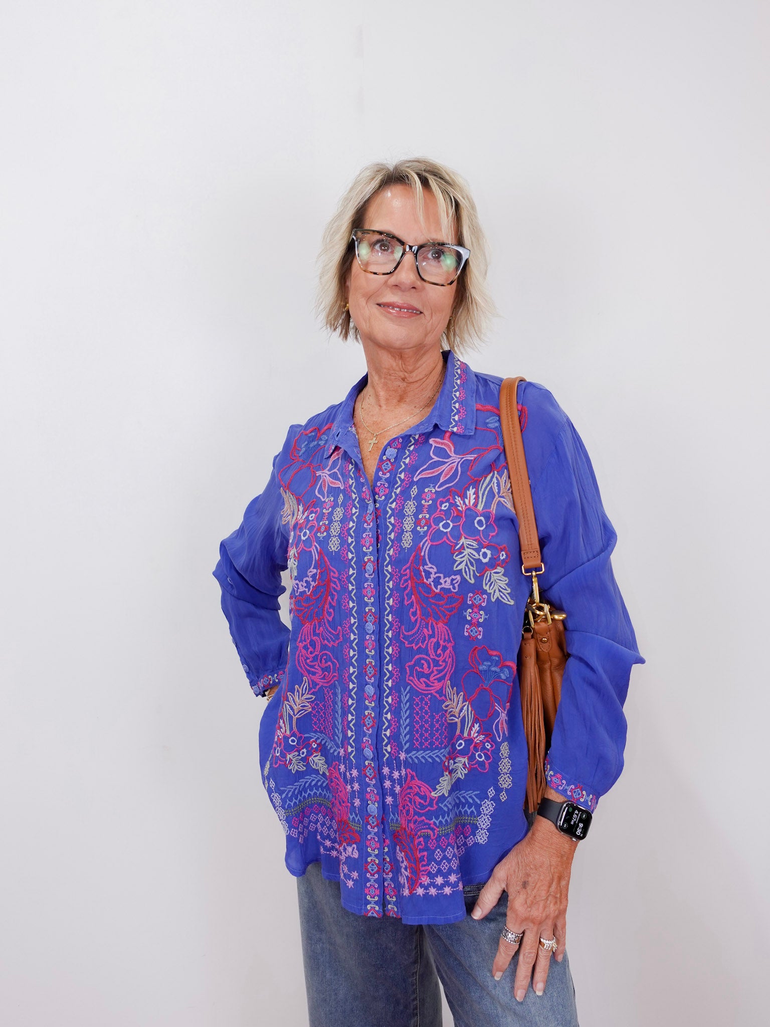 front view of the luisa shirt styled casually with jeans and sneakers