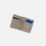 Back of the Lumen Mini Wallet showing the snap pocket in golden granite nunbuck leather.