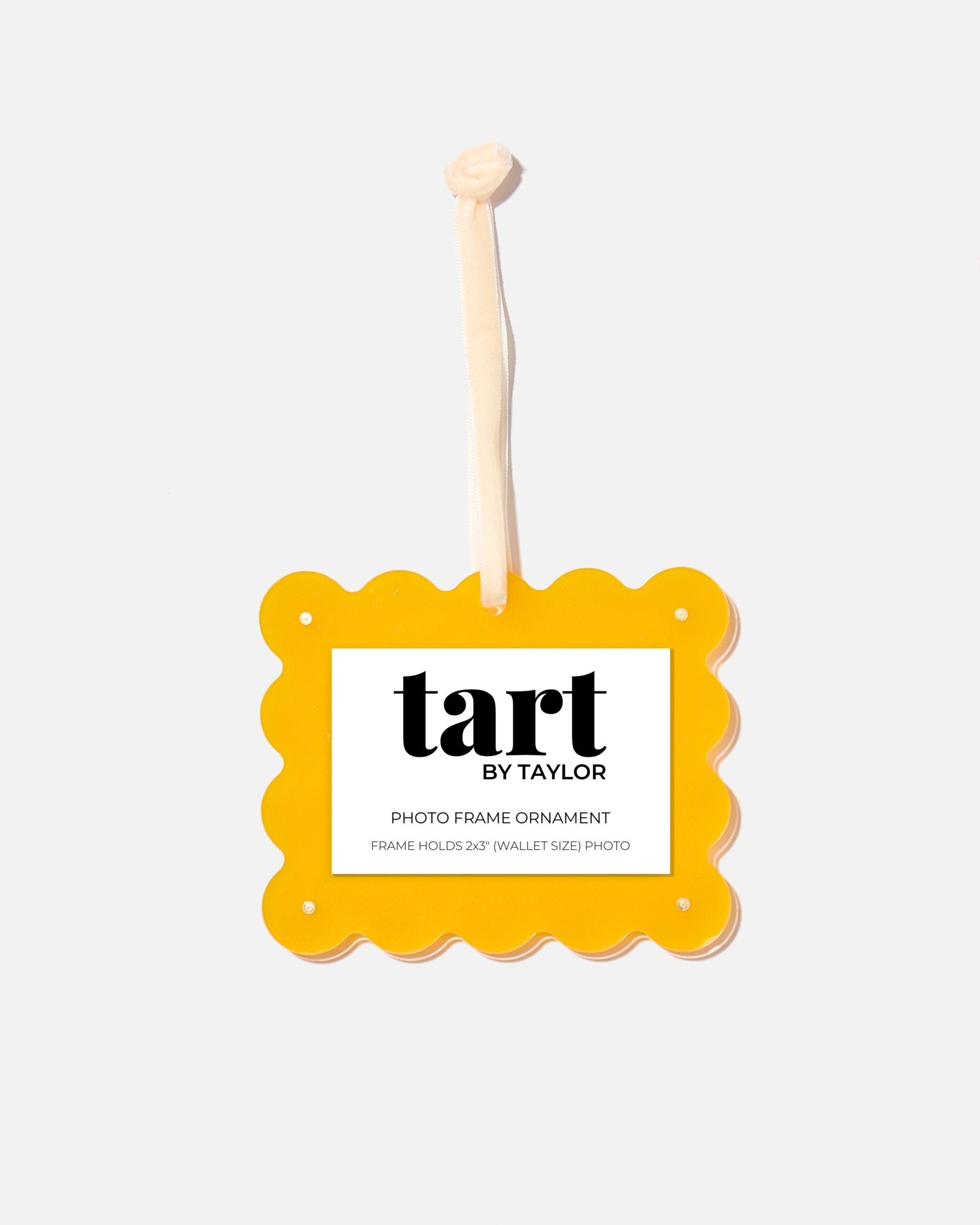 Yellow photo frame ornament with 'tart by Taylor' branding on a white background