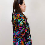 woman wearing a johnny was margot silvana blouse with bold boho paisley design
