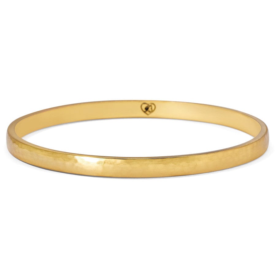 Gold bangle on a white background