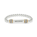 Silver bracelet with a bar charm displaying the word 'BELIEVE' on a white background