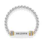 Silver beaded bracelet with a central bar engraved with 'BELIEVE' on a white background