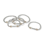 Set of silver bracelets with engraved words on a white background