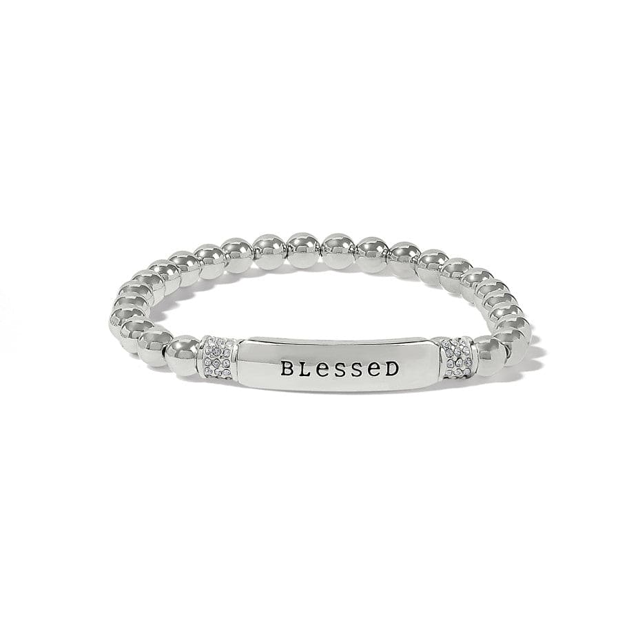 Silver ring with 'Blessed' engraving on a white background