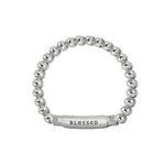 Silver beaded bracelet with a 'blessed' tag on a white background