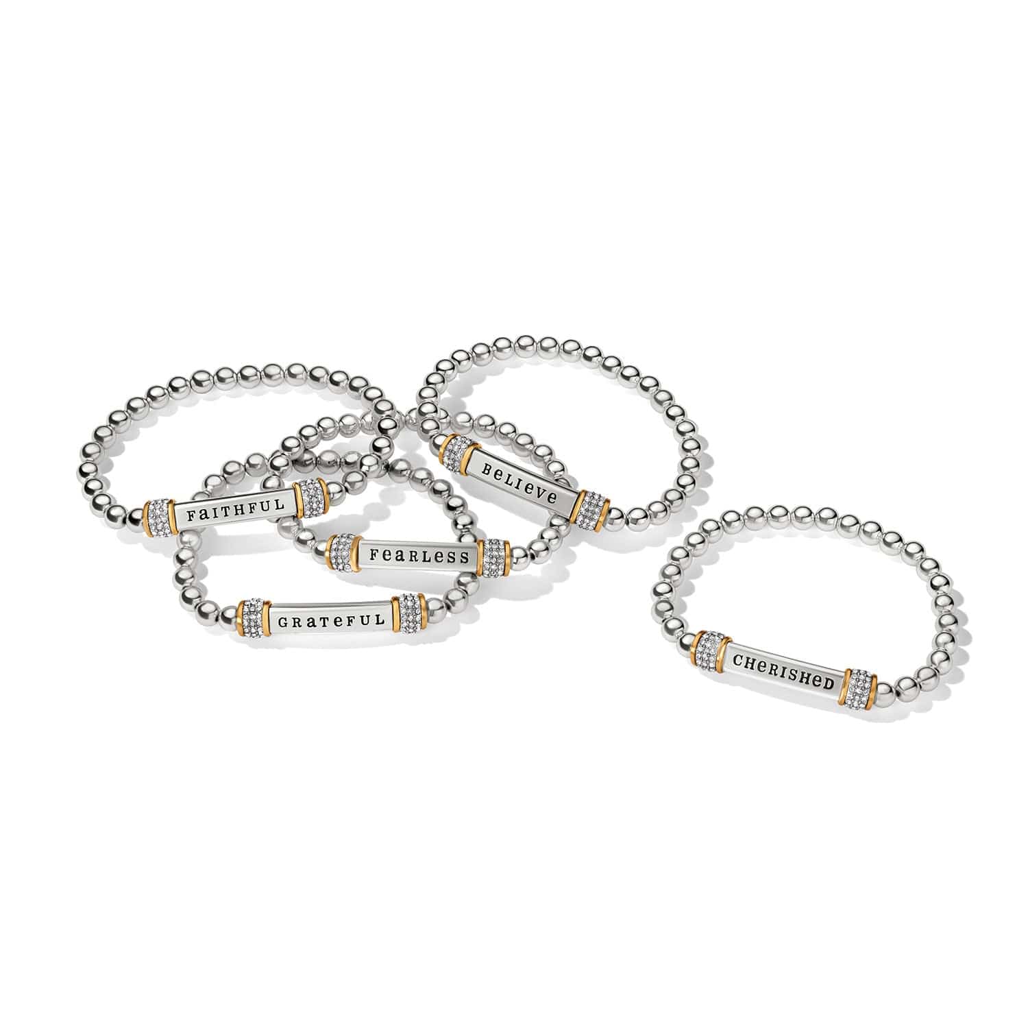 Set of silver bracelets with engraved words on a white background