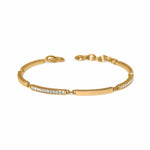 Gold bracelet with embedded stones on a white background