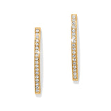 Gold hoop earrings with embedded stones on a white background