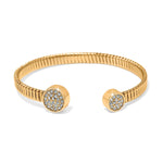 Gold bracelet with circular ends featuring gemstones on a white background