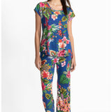 Woman wearing a colorful floral pajamas on a white background