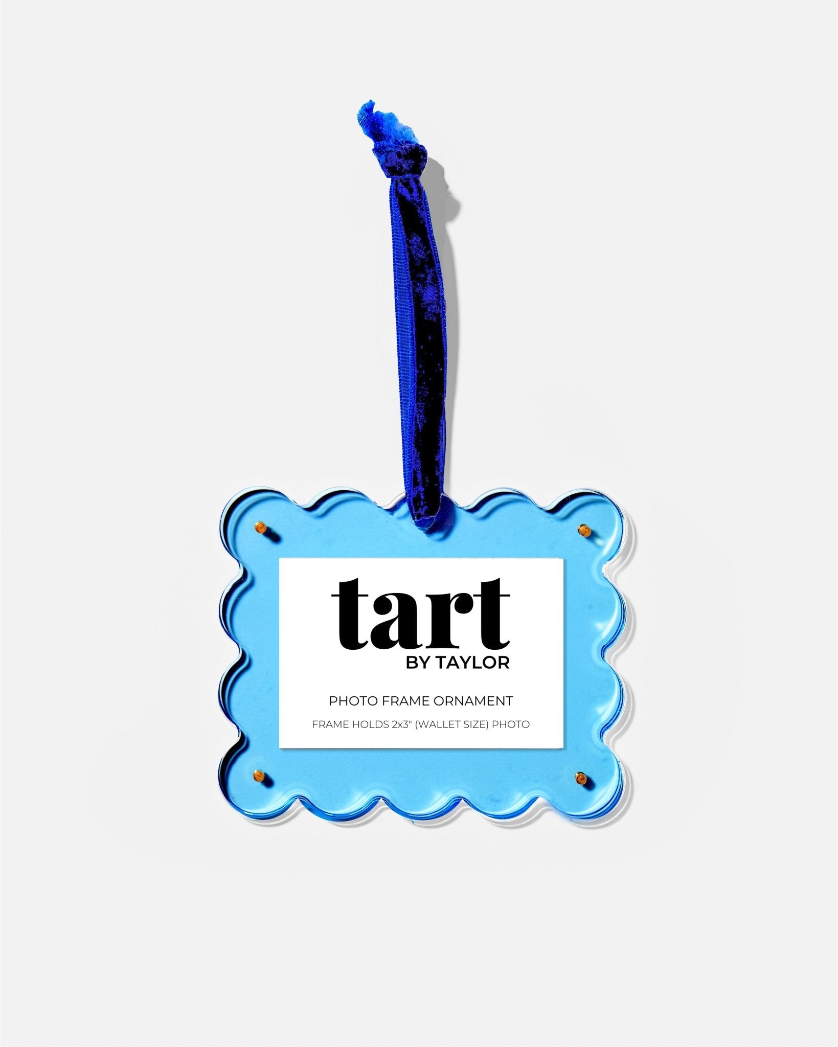 Blue decorative ornament with 'tart by Taylor' branding on a white background