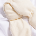 Close-up of a beige fabric item on a white background