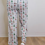 Person wearing a patterned outfit with a neutral background